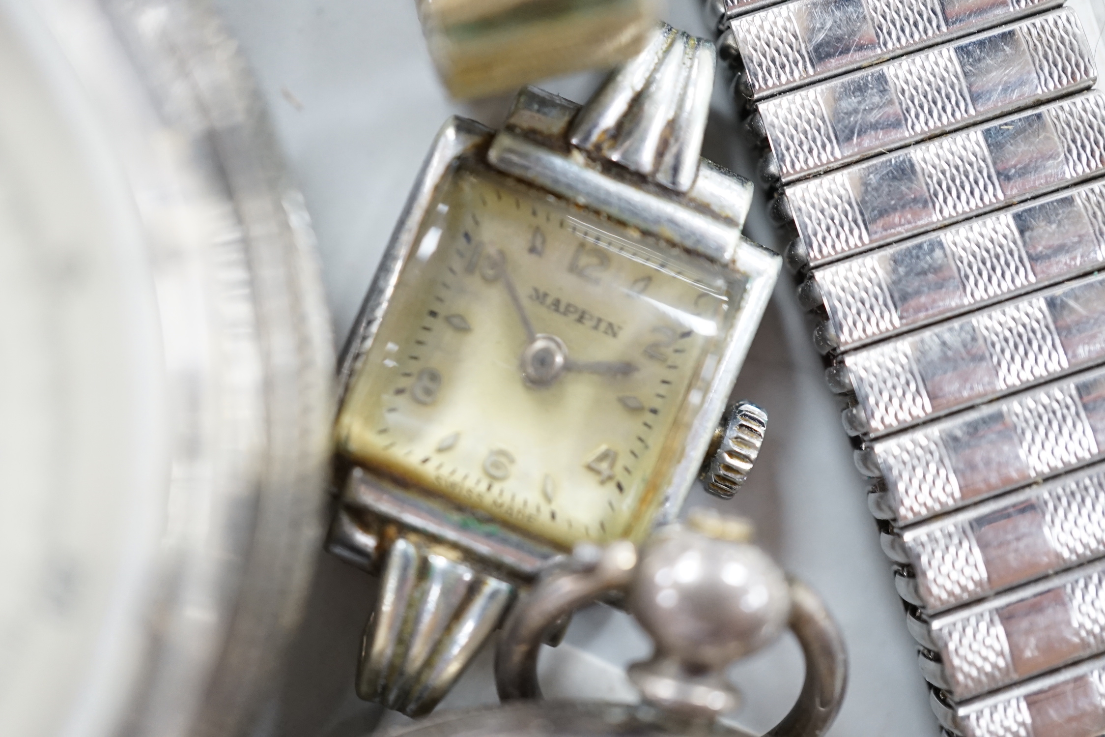 Twenty one assorted silver or base metal pocket watches including Waltham and Child of Birmingham, three wrist watches and a silver vesta case.